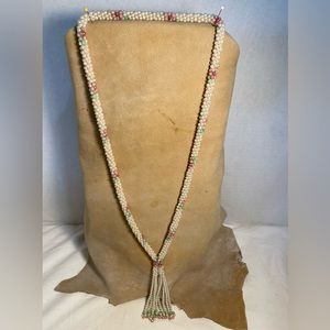 1970’s long slip over pearl necklace with pink green and gold designs
